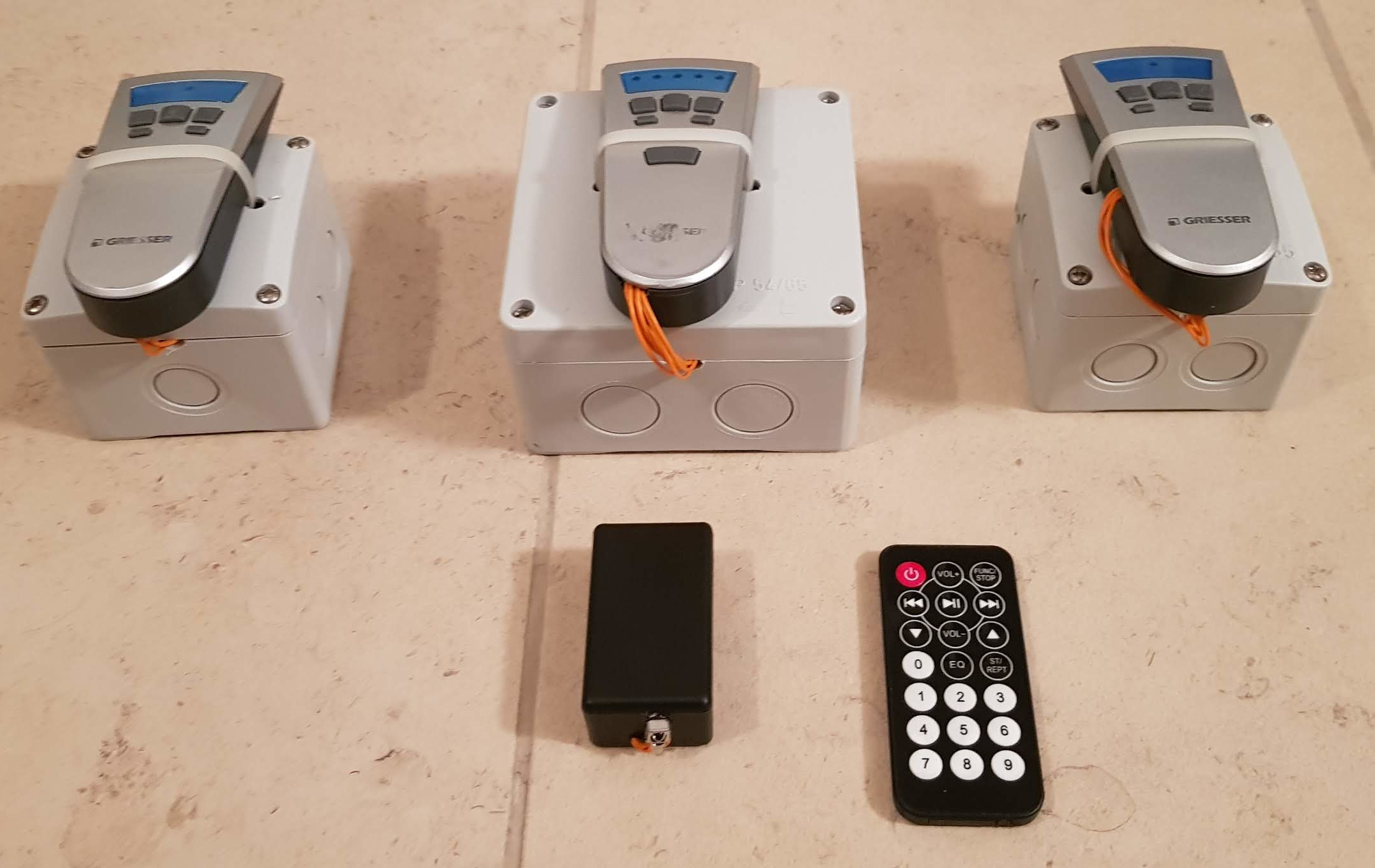 Three final assembled box for stores control + IR stores remote
